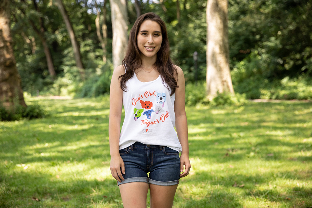 a woman with an aspca tank top in the park