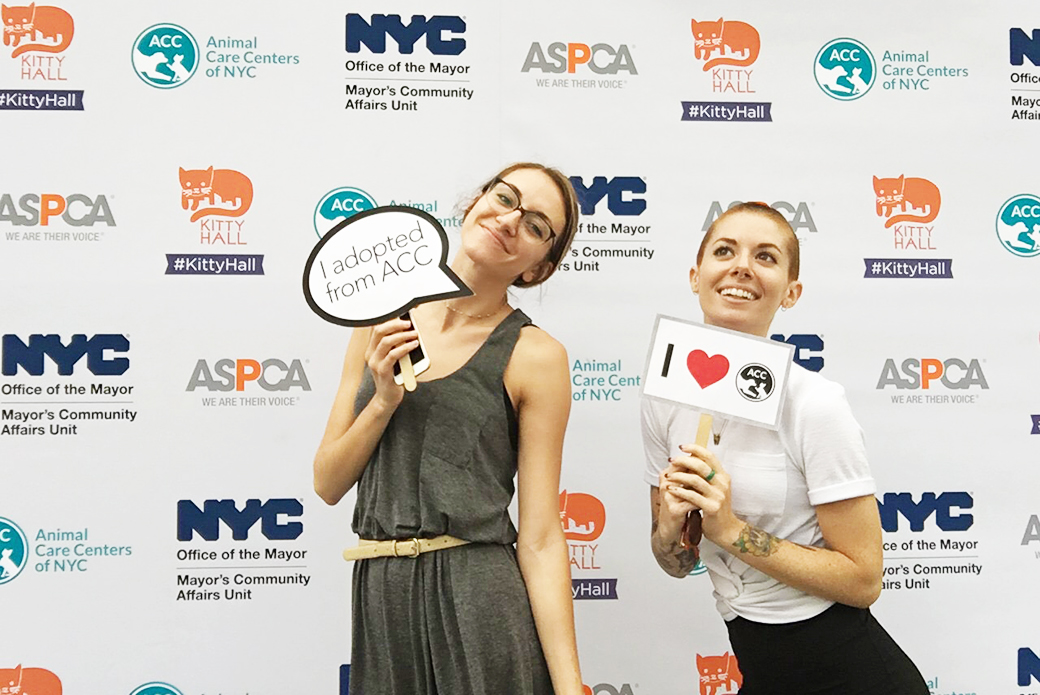 ASPCA staff holding ACC signs