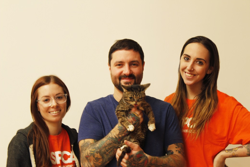 Lil BUB poses with ASPCA staffers and her pet parent, Mike Bridavsky. 