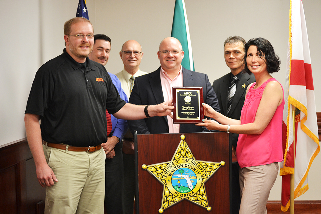 Recipients from Walton County, Florida, receive their award.