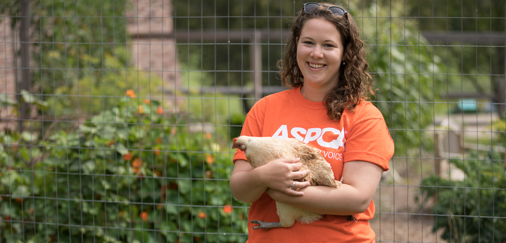 ASPCA volunteer with a chicken