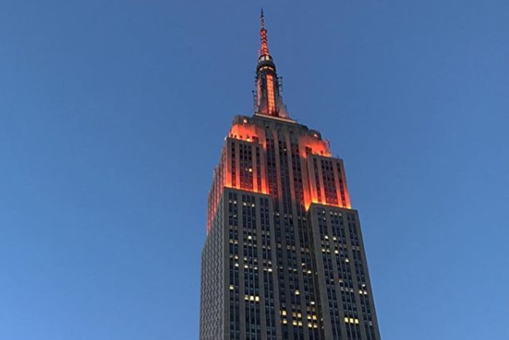 The Empire State Building lit orange