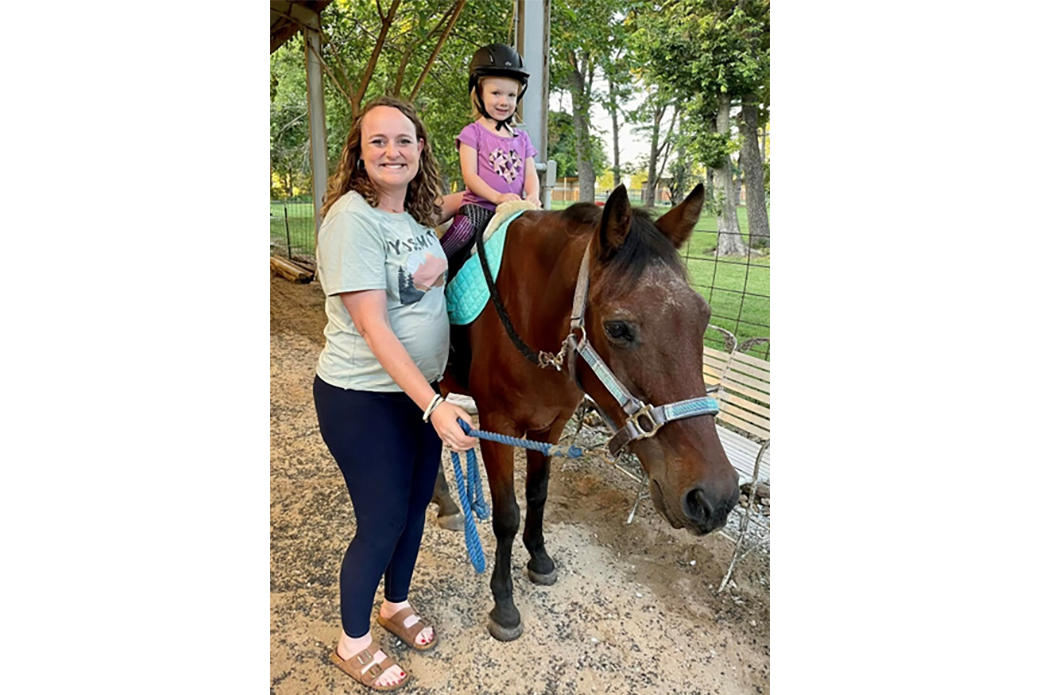 Katie with her niece riding Gramps