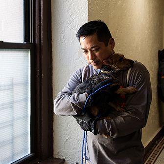 ASPCA responder carrying rescued dog