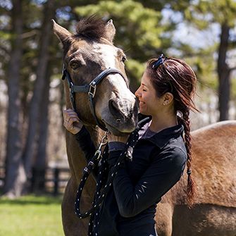 a woman with a horse