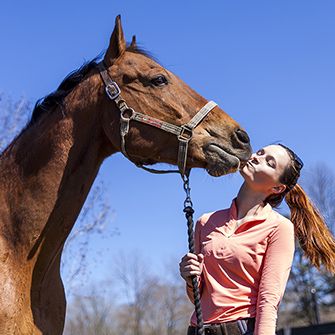 a horse and woman