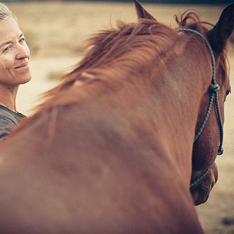 a woman with a horse