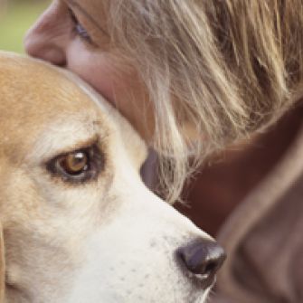 Woman hugging beagle